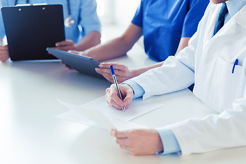 Image showing close up of happy doctors at seminar or hospital