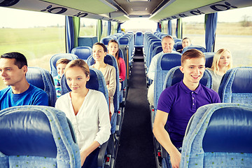 Image showing group of happy passengers in travel bus