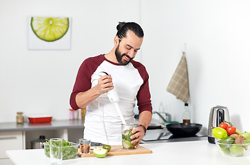 Image showing man with blender cooking food at home kitchen