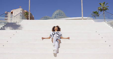 Image showing Female posing lying on the stairs