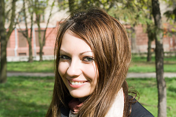 Image showing Portrait of the smiling nice girl outdoor