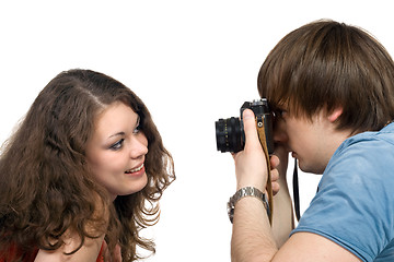 Image showing Photographer taking pictures of the young woman. isolated 3