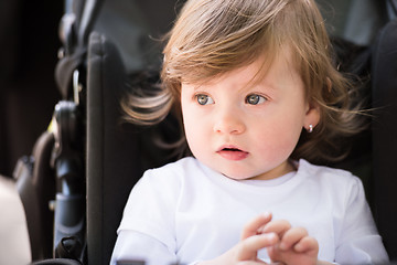 Image showing baby girl sitting in the pram