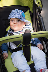 Image showing baby boy sitting in the pram