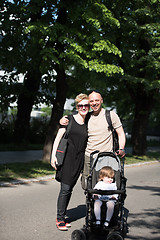 Image showing couple with baby pram in summer park