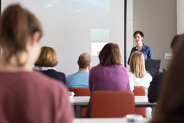 Image showing Woman giving presentation in lecture hall at university.