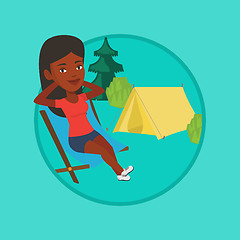 Image showing Woman sitting in folding chair in the camp.