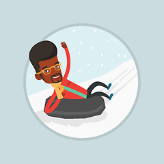 Image showing Man sledding on snow rubber tube in the mountains.