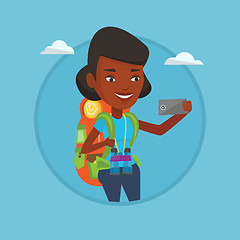 Image showing Woman with backpack making selfie.