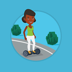 Image showing Woman riding on self-balancing electric scooter.