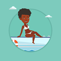 Image showing Young happy woman tanning on sailboat.