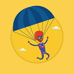 Image showing Young happy man flying with parachute.