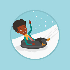 Image showing Woman sledding on snow rubber tube in mountains.