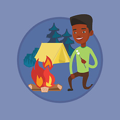 Image showing Businessman roasting marshmallow over campfire.