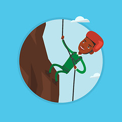 Image showing Man climbing in mountains with rope.