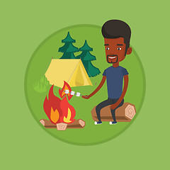 Image showing Businessman roasting marshmallow over campfire.