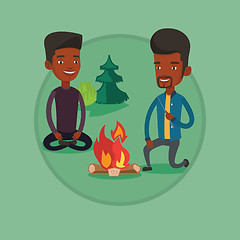 Image showing Two friends sitting around bonfire in camping.