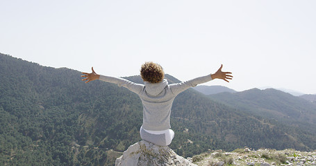 Image showing Happy woman posing with hands apart