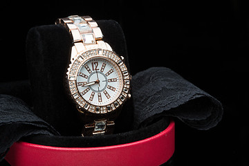 Image showing gold watch isolated on black background