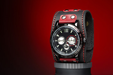 Image showing men\'s watches with wide leather red bracelet 