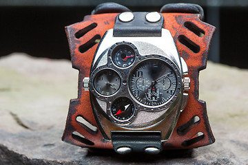 Image showing watches with several dials and leather bracelet