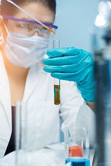 Image showing Young scientist handling chemical agents