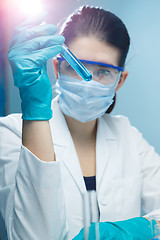 Image showing Girl working with test tubes