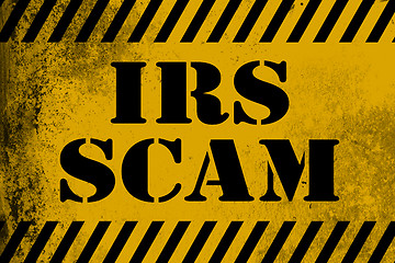 Image showing IRS scam sign yellow with stripes