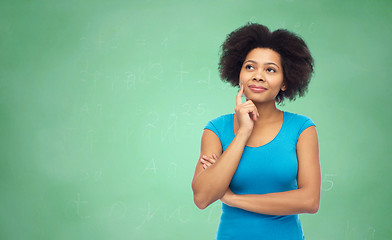 Image showing pensive afro american  woman over green chalkboard