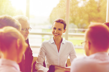 Image showing smiling business people meeting in office