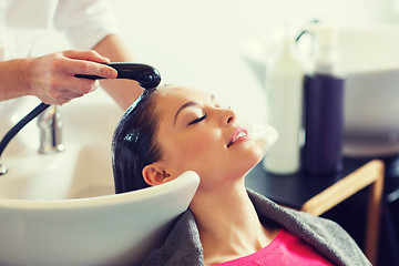 Image showing happy young woman at hair salon