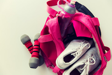 Image showing close up of female sports stuff in backpack