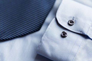 Image showing close up of shirt and blue patterned tie