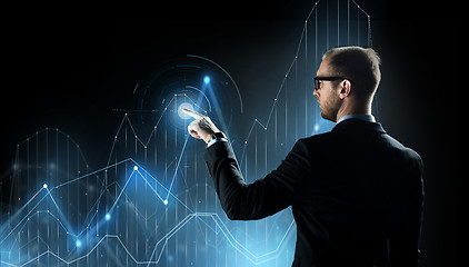 Image showing businessman with virtual diagram chart projection