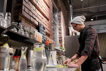 Image showing man or barman cooking smoothie at vegan cafe