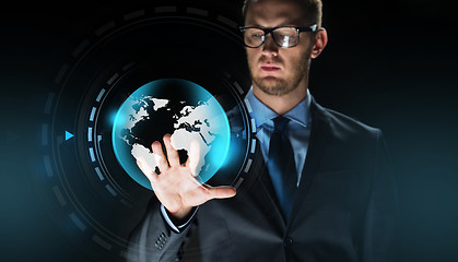 Image showing businessman with virtual earth globe projection