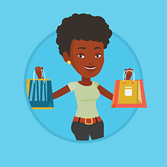 Image showing Happy woman holding shopping bags.