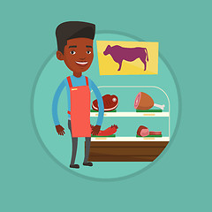 Image showing Butcher offering fresh meat in butchershop.