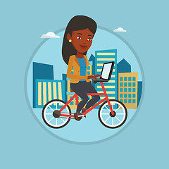 Image showing Woman riding bicycle in the city.
