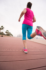 Image showing woman running on the promenade