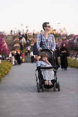 Image showing mother and daughter in flower garden