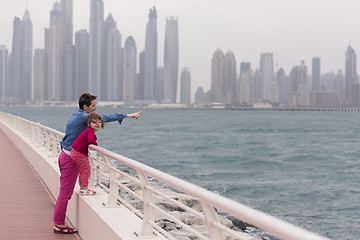 Image showing mother and cute little girl on the promenade