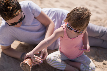 Image showing Mom and daughter on the beach