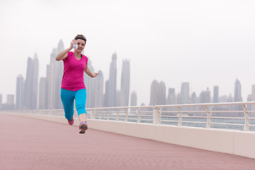 Image showing woman running on the promenade