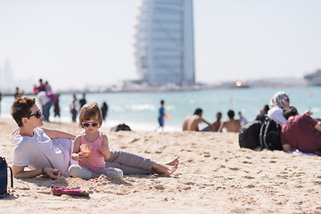 Image showing Mom and daughter on the beach