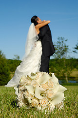 Image showing Wedding bouquet and couple