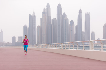 Image showing woman running on the promenade