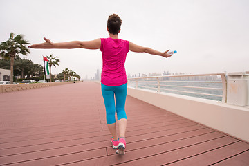 Image showing young woman celebrating a successful training run