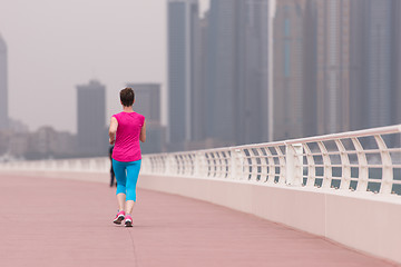 Image showing woman running on the promenade