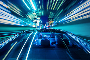 Image showing Couple sitting in a car, heading for the big city